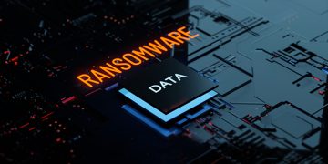 3D rendering Glowing text Ransomware attack on Computer Chipset. spyware, malware, virus Trojan, hacker attack Concept
