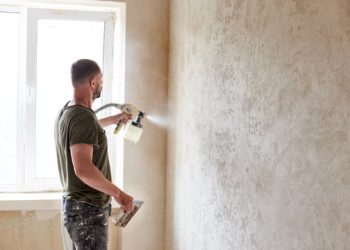 Spraying Plaster On Walls