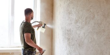 Spraying Plaster On Walls