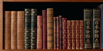 Antique books on a shelf, from our own original public domain library collection.
