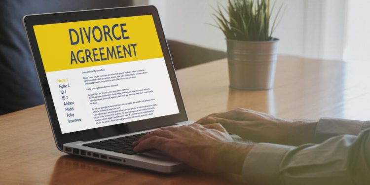 Laptop computer with Divorce Agreement in the screen.