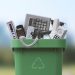 Waste bin full of electronics, e-waste and recycling concept