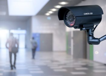 The concept of security through surveillance camera in the corporation or government building.